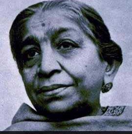Small archival photographic portrait of Sarojini Naidu, head and shoulders, looking towards the camera.